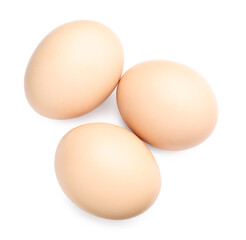 Three raw chicken eggs isolated on white, top view