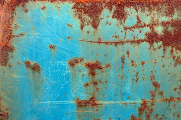 Rusty metal surface with blue paint. Abstract background and texture for design.