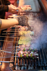 Close-up of food at night market barbecue stall