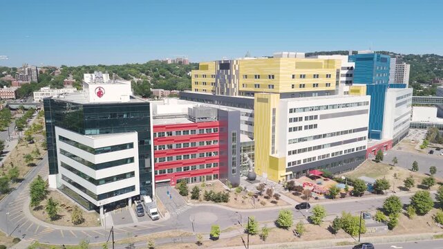 Aerial view of MUHC hospital complex in Montreal, featuring Shriners Hospital and Montreal Children&rsquo;s Hospital, highlighting modern medical architecture.