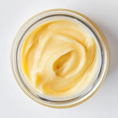 Yellow cream swirl in clear jar, viewed from above
