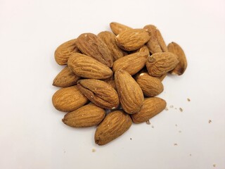Fresh pile of delicious almonds on a bright background