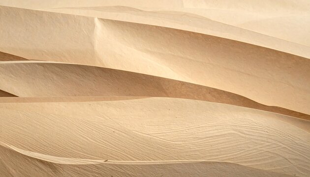 Close-up of undulating beige sand dunes, capturing the texture and shadows created by the wind. A minimalist, natural landscape
