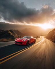 Red sports car driving on winding road during sunset in mountainous landscape