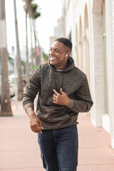Fototapeta premium Handsome African American man enjoying a sunny autumn day in Miami