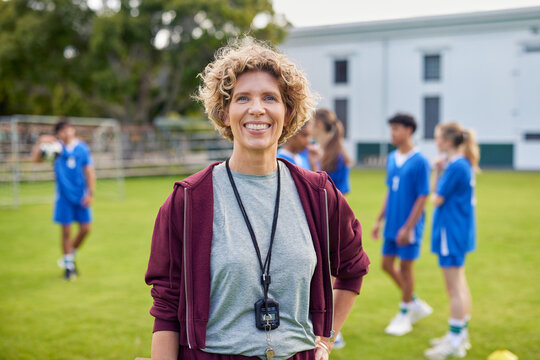 Confident female sports coach smile during lesson