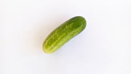 ripe green yellowish cucumber isolated in white background