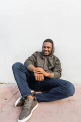 Fototapeta premium Handsome man in a hoodie enjoying the autumn vibe