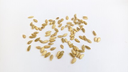 dried pumpkin seeds isolated in white background