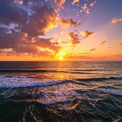 Sunset sky over ocean with breaking waves