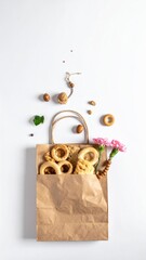 Pastries, nuts and flowers in bag