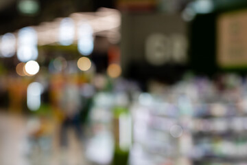 An unclear image of a shopfront with an exit sign