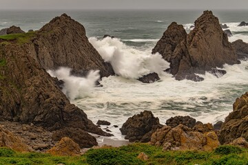 Rugged coastline with powerful waves crashing against rocks