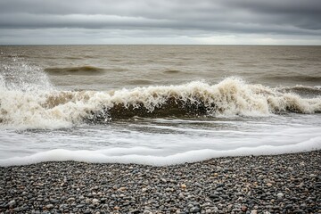 Ocean waves crashing on a pebbled shore