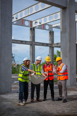 Engineers, architects and inspectors are working together to plan the strengthening of the structure of a large building.