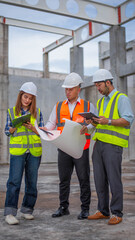 Expert engineers and architects are working together to check whether the building structure complies with the structural plans.