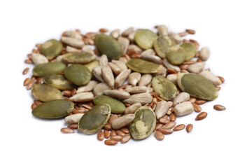 Pile of pumpkin, sunflower and flax seeds isolated on white
