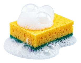 A yellow rectangular cleaning tool with green scrub pad covered in bubbly white soap