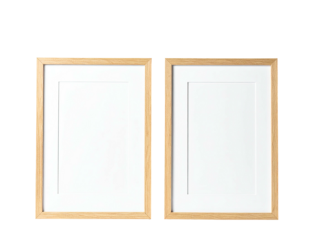 Two light-wood picture frames, vertically oriented, with white matting and empty spaces