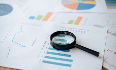 Top view documents with analytics data on table