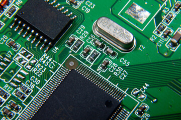 green electronic printed circuit board with assembled radio components