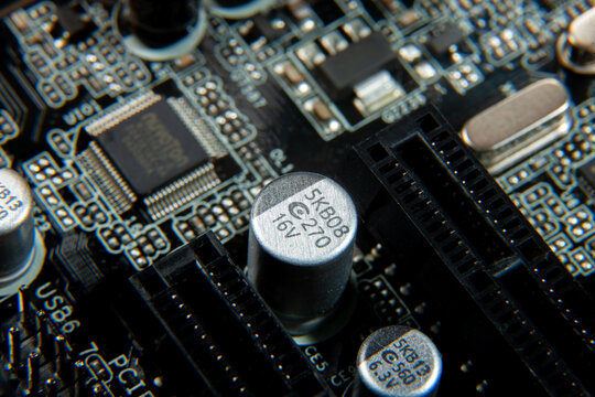 A close-up view of an electronic printed circuit board with assembled radio components