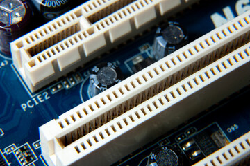 Close-up of an assembled electronic printed circuit board with slots and connectors