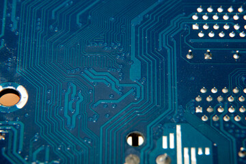 A close-up of a fragment of a blue electronic circuit board