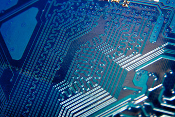 A close-up of a fragment of a blue electronic circuit board