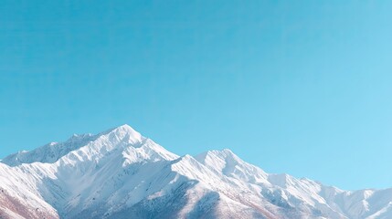 Obraz premium Scenic Snow-Capped Mountains Under Clear Blue Sky with Vibrant Natural Landscape and Tranquil Atmosphere