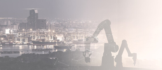 Industry 4.0 with robotic arm and cityscape at night