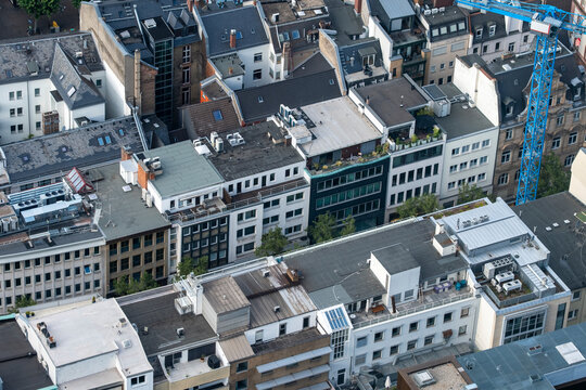 Dense aerial composition of Frankfurt rooftops and buildings with geometric urban pattern and architectural variety