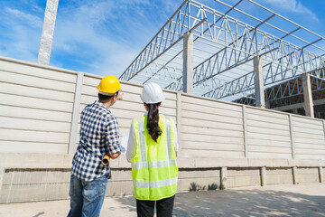 Engineers discussing construction project during site inspection