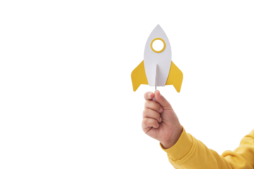 child's hand holding a toy rocket isolated on white background