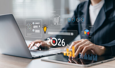 Businesswoman using laptop with the year 2026.