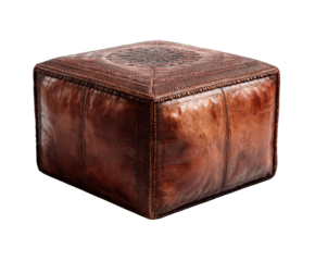 A rustic brown leather pouf with intricate embossed patterns, isolated on transparent background