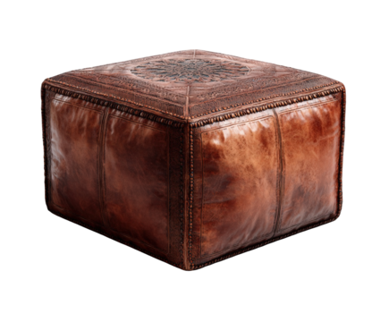 A rustic brown leather pouf with intricate embossed patterns, isolated on transparent background