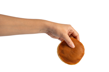 Japanese sweets Dorayaki in hand on transparent background