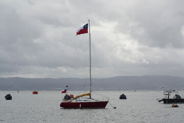 Fototapeta premium Small Sailboat on the Coast of Chile