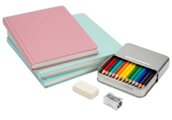 Isolated school stationery items on desktop. Pink journal and colored pencils on table