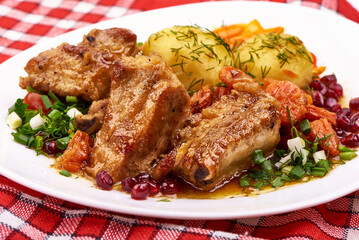 Roasted Pork Ribs with Potatoes, Carrots, Herbs. Fresh Food Dish