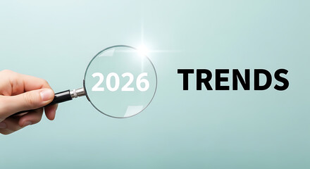 Magnifying glass revealing future trends for the year 2026