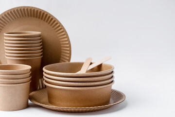 Set of disposable tableware on white background, closeup. Space for text