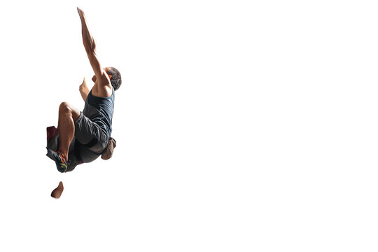 Dynamic climber demonstrating strength and focus during a challenging ascent with reach up high