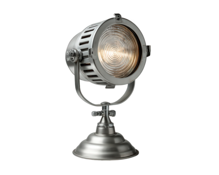 Warm vintage industrial metal spotlight lamp with fresnel lens. This isolated object, studio light on stand, provides cozy illumination for home or office decor