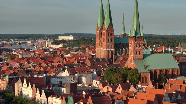 Lubeck city Aerial shot. Saint Marie and saint peter churches, Holstentor Gothic gate, Schleswig-Holstein land, Germany
