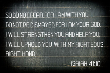 The Bible verse Isaiah 41:10. The text reads: "So do not fear, for I am with you" on chalkboard.