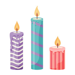 Three colorful striped candles with melting wax and flames
