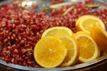 Fresh Pomegranate and Orange Slices for Juice Preparation