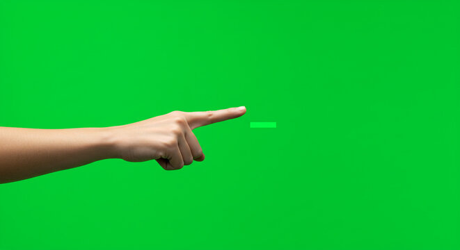 Confident hand pointing with index finger towards a bright green screen background, ready for creative compositing.